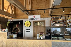 The interior of the hut is bright and modern. There is a self-service counter on site.