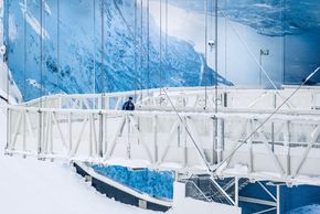 The trail hangs from the ceiling of the ski hall.