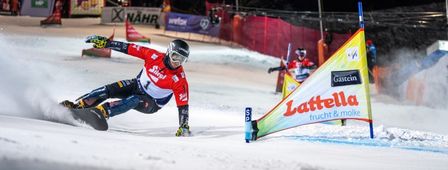 The snowboarders go head-to-head in the alpine race.