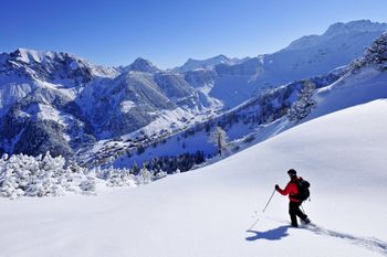 Explore the wintery landscabe of Malbun on a snowshoe tour.