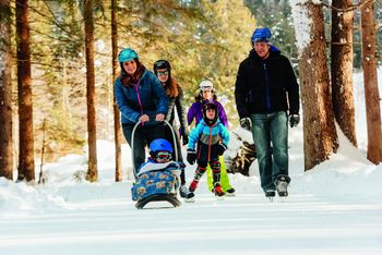 Ice skating in the forest is a great activity for a family day trip.