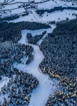 The steep Gran Risa piste winds through picturesque woodland.