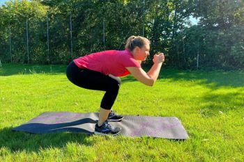 Strengthen your thighs and core with the downhill squat.