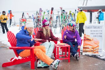 Skiers enjoy free pancakes with fresh snow in Aspen.
