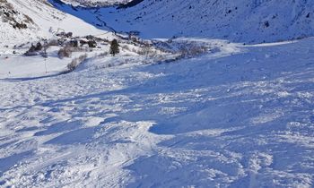 Observe the mogul from above before you get ready to ski down.