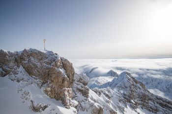 From the rooftop terrace of the mountain station, you get a fantastic panoramic view, including a glimpse of the Zugspitze's golden summit cross.
