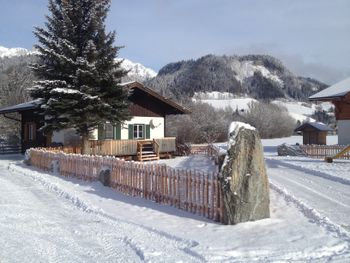Ansicht Winter Ferienhaus - Blockhaus Abendrot