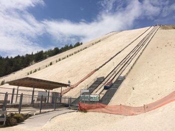 A modern lift takes visitors up the hill.