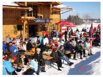The large sun terrace with a view of the slopes and the children's slide paradise