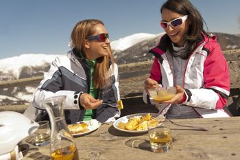 Austrian delicacies are served to winter sports enthusiasts at the huts in Carinthia.