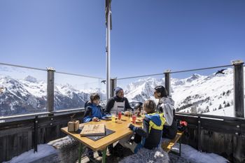 Traditional mountain huts invite a stop for refreshments.
