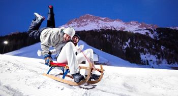 Under floodlights, you can not only ski but also go sledding in the Obereggen ski resort in the evenings.