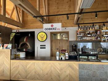 The interior of the hut is bright and modern. There is a self-service counter on site.